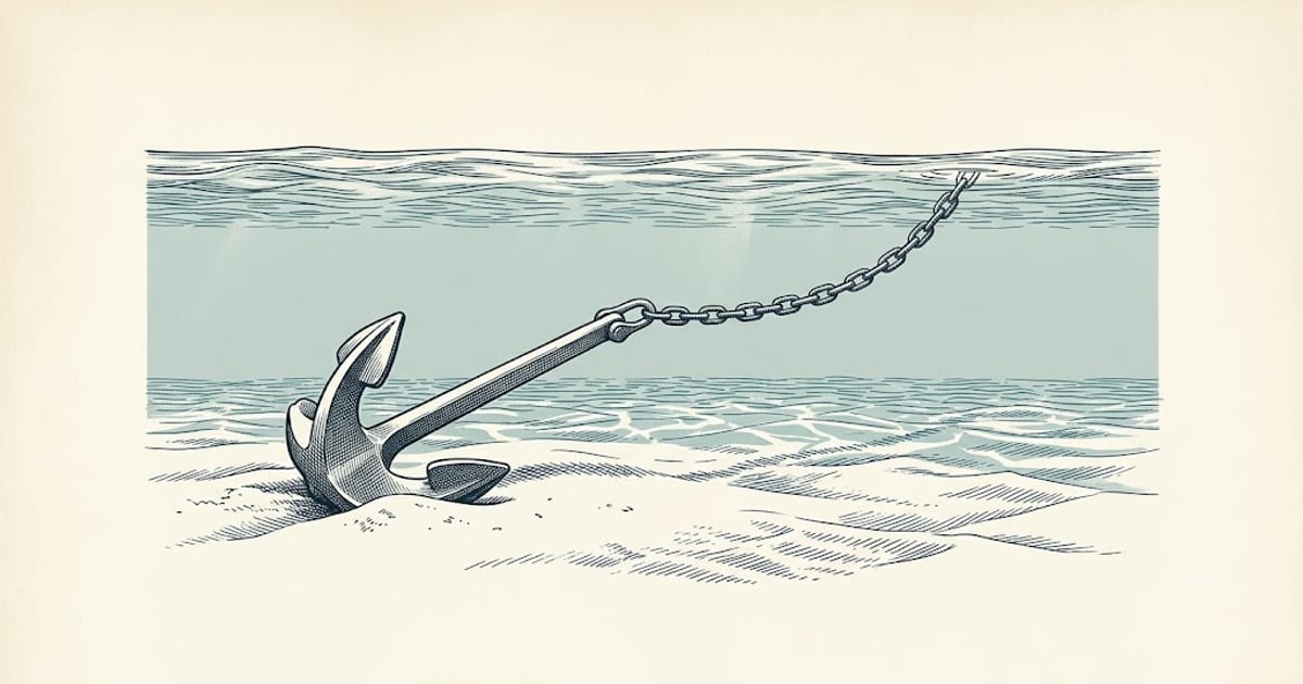 Anchor set into a sandy seabed seen from underwater